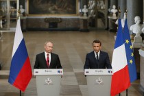 France’s Macron says no international problem can be solved without Russia